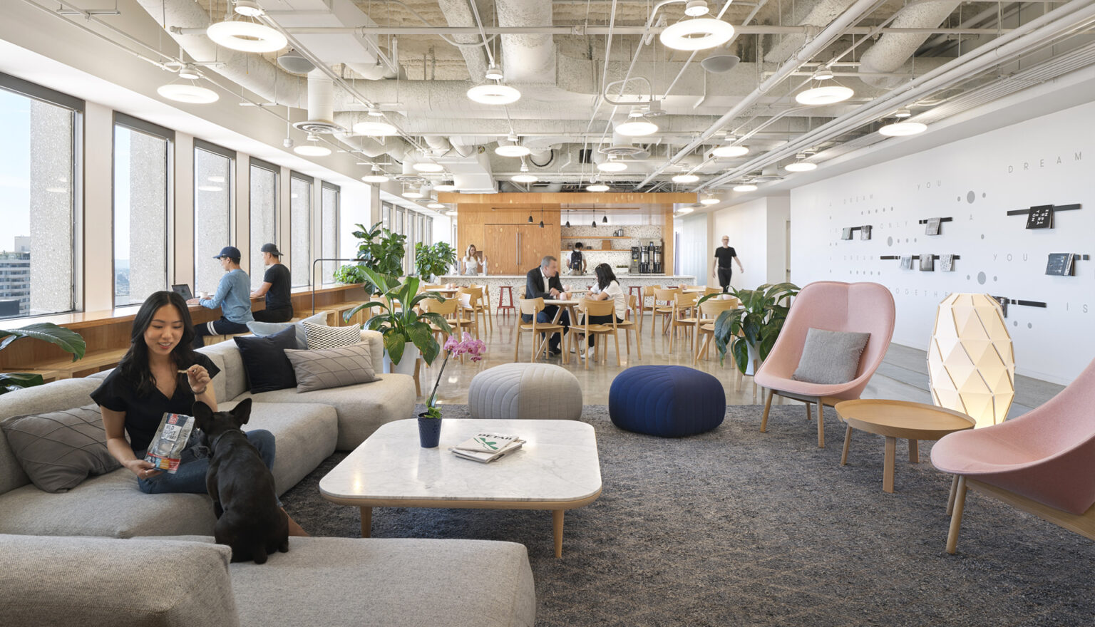 Ethos Society coworking lounge with floor-to-ceiling windows overlooking Koreatown, Los Angeles.